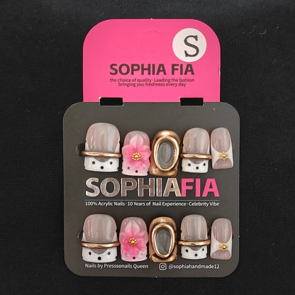 Press On Nails Short Square Korean Minimal Luxury Style - Sheer Nude White Polka‑Dot French Tip, 3D Pink Flower with Gold‑Bead Center, Thin Gold Band and Hollow Oval Gold Frame Acrylic Nail Tips